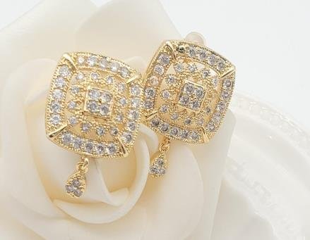 Arete Huggie Baño de Oro 18K