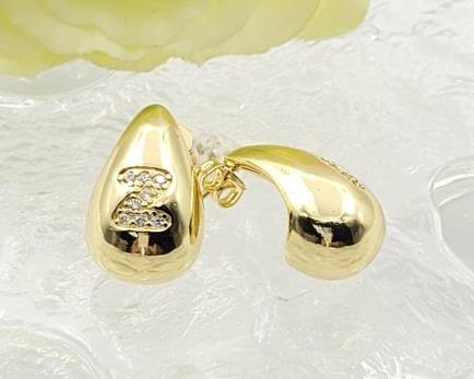 Arete Huggie Baño de Oro 18K