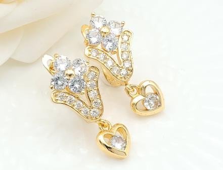 Arete Huggie Baño de Oro 18K