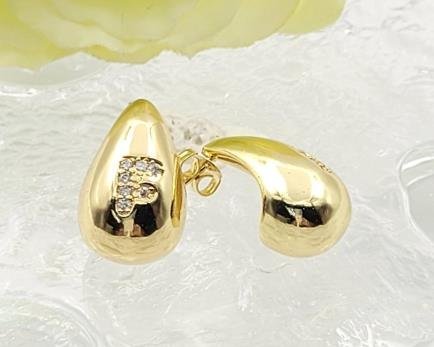 Arete Huggie Baño de Oro 18K