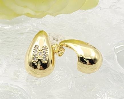 Arete Huggie Baño de Oro 18K