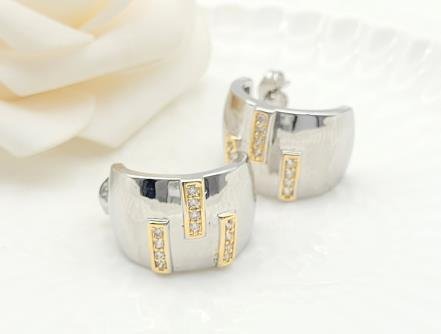 Arete Huggie Bicolor Oro y Rodio