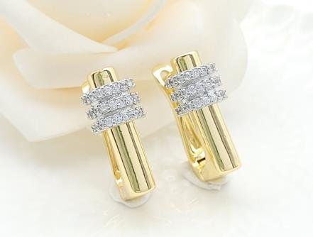 Arete Huggie Bicolor Oro y Rodio