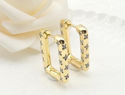 Arete Huggie Bicolor Oro y Rodio