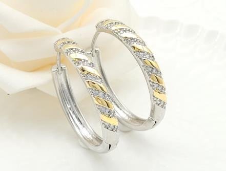 Arete Huggie Bicolor Oro y Rodio